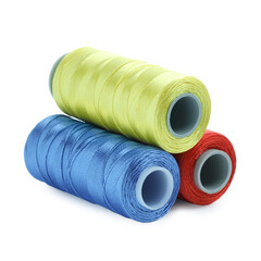 Spools of bright sewing threads isolated on white