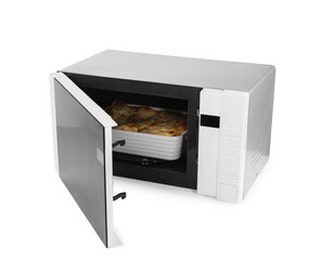 Open microwave oven with tasty lasagna isolated on white