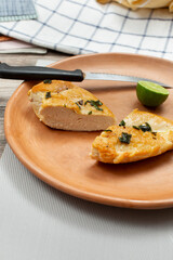 A view of a plate of tequila lime chicken breast.