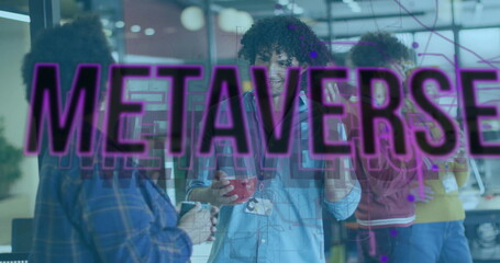 Image of metaverse text over diverse colleagues talking in office