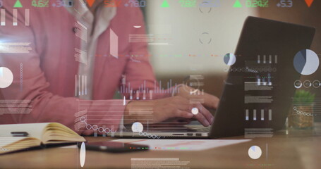 Image of data processing over asian businessman using laptop in office