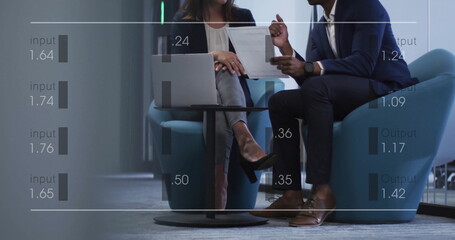 Image of financial data processing over diverse business people in office