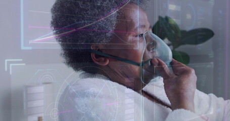 Image of data processing and diagrams over senior biracial woman using oxygen mask