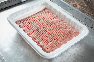 A view of a package of ground chicken.