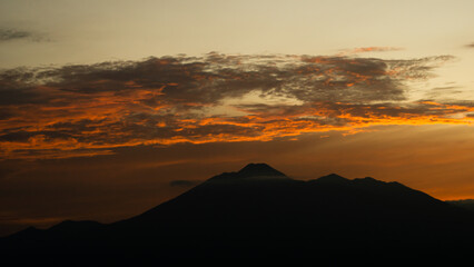 Mountain Silhouette at Dawn with Orange Sky