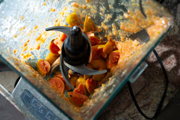 A view of chunks of guava inside a blender.