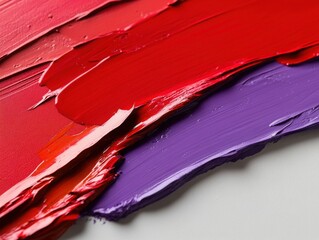 Bold Brushstrokes: A close-up of an abstract painting featuring dynamic brushstrokes in shades of crimson red, deep violet, and a hint of electric blue. 