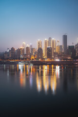 Stunning Night Cityscape of Chongqing with Vibrant Reflections