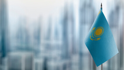 A small Kazakhstan flag on an abstract blurry background