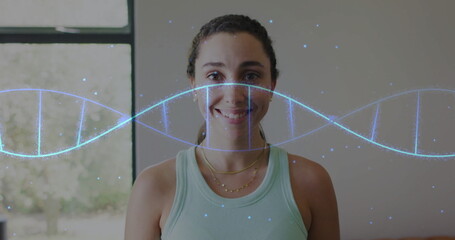 Image of dna strand over portrait of caucasian woman at home