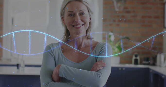 Image of dna strand over portrait of caucasian woman at home