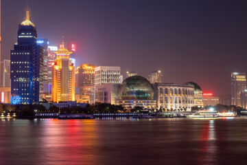 Obraz premium Vibrant Night Cityscape of Shanghai Illuminated by Stunning Lights