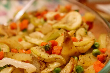 
a bowl of potato salad made with a variety of vegetables