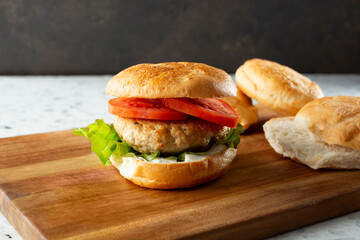 A view of chicken burger, featuring a gluten-free bun.