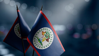 A small Belize flag on an abstract blurry background