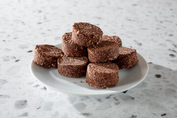 A view of a pile of chocolate coconut cookies.