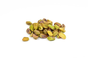 Peeled pistachios pile isolated on white