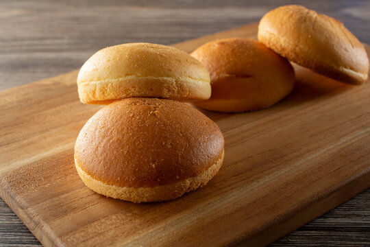 A view of a pile of gluten-free burger buns.