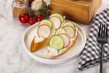 Bruschetta with soft cheese and radishes