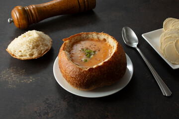 A view of a bread bowl of lobster bisque.