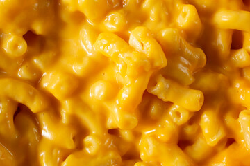 A top down view of a pile of macaroni and cheese, as a background.