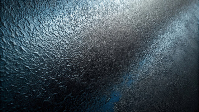 A textured surface with a mix of blue and gray hues creates a rough, almost metallic appearance. Light reflections highlight the unevenness and depths, adding a dynamic effect.AI