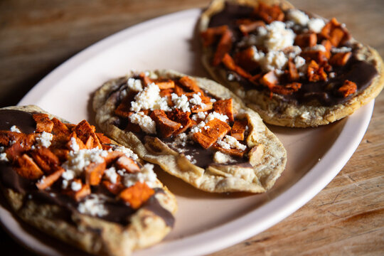 Memelas with beef jerky. Memela is an oval tortilla, made of corn dough and hand-made, traditional in the cuisine of Oaxaca in Mexico.