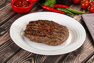 Grilled beef burger cutlet with sauce