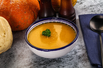 Vegan pumpkin cream soup served sesam