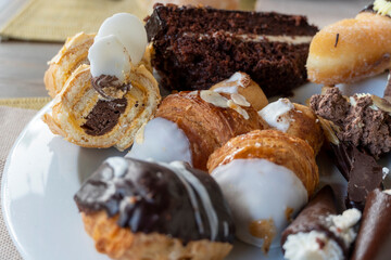 A variety of pastries on plate in hotel buffet