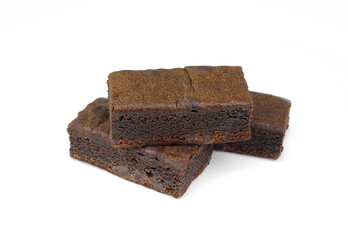 Pieces of fresh brownie on white background. Delicious chocolate pie