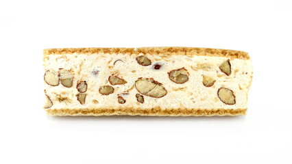 French soft nougat with almond and nuts isolated on white background. Greek manolato. White nougat bar isolated.