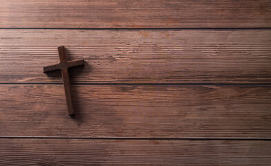 Good Friday and Holy week concept - A religious cross on dark wooden background.