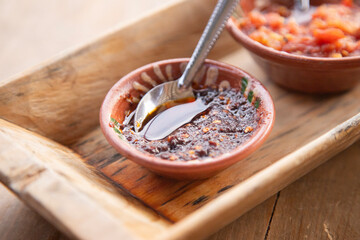 Authentic traditional spicy chili sauce with tomato in a restaurant in Oaxaca, Mexico.
