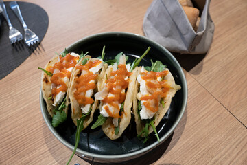 Gourmet burritos stuffed with asparagus and sauces in restaurant Alicante Spain
