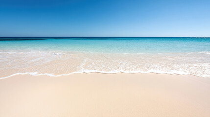 tranquil beach with gentle waves and soft sand under clear sky