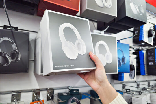Headphones in hand in store