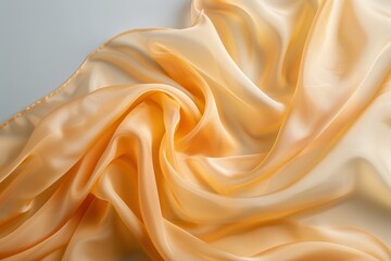 Obraz premium Elegant Soft Draped Satin Fabric in Warm Honey Tone with Gentle Flow and Sheen for Textiles and Backgrounds