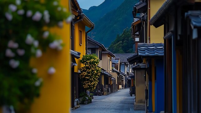 Serene evening in a traditional village with colorful houses and lush mountains in the background