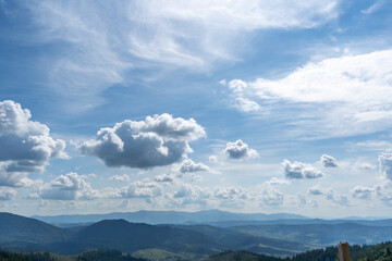 Sky over Mountains ranges. Green forest Nature