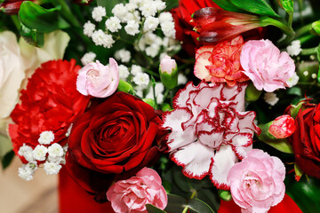 Romantic floral background with rose, carnation and gypsophila paniculata flowers.
