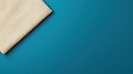 Fototapeta premium Neutral Fabric Texture on Vibrant Teal Background for Design Use