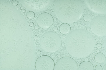Macro microscope green bubble texture, Close-up Green bubbles and drops oil background . blue green...