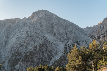 Hiking in the beautiful Samaria National Park in Crete where you hike between a gorge.