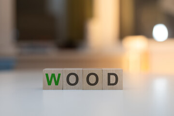 Wooden Cubes on the Table with WOOD Written on Them