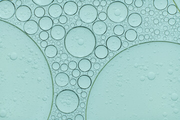 Macro microscope green bubble texture, Close-up Green bubbles and drops oil background . blue green...