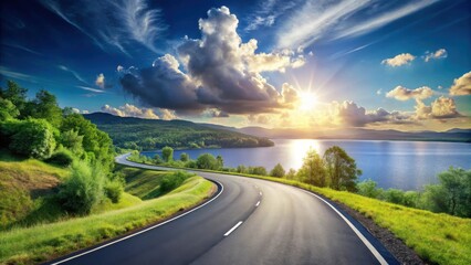 Scenic asphalt road winding along a tranquil lake under a vibrant sunset sky