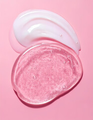 An image of cosmetic skincare textures with smears of white cream and clear gel on a pink background.