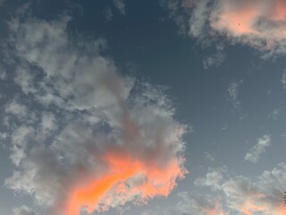 Pretty clouds, orange and vanilla sky in the evening.