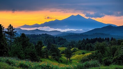 Obraz premium Majestic Mountain Landscape at Sunset with Colorful Sky and Lush Green Hills in the Foreground